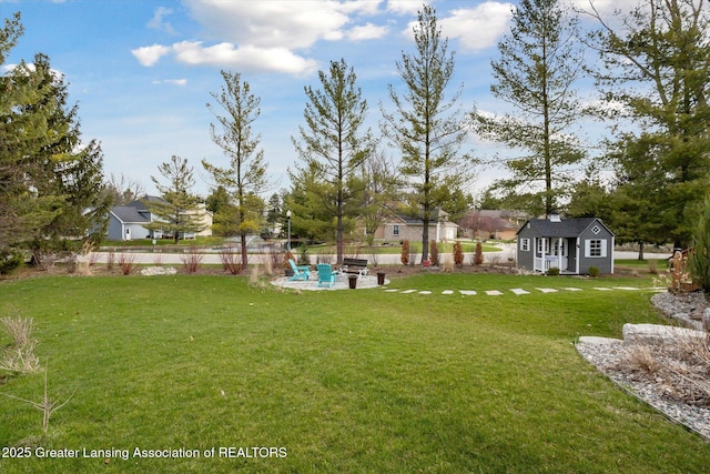 3430 Hawthorne Woods Pkwy, Dewitt, MI 48820 - view of yard featuring a patio and an outdoor structure