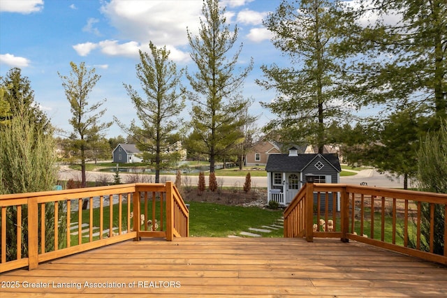 3430 Hawthorne Woods Pkwy, Dewitt, MI 48820 - wooden deck featuring a yard and an outbuilding