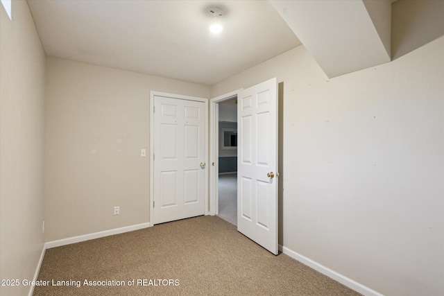 3430 Hawthorne Woods Pkwy, Dewitt, MI 48820 - unfurnished bedroom featuring light colored carpet and baseboards