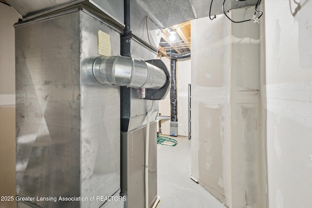 3430 Hawthorne Woods Pkwy, Dewitt, MI 48820 - utility room with heating unit