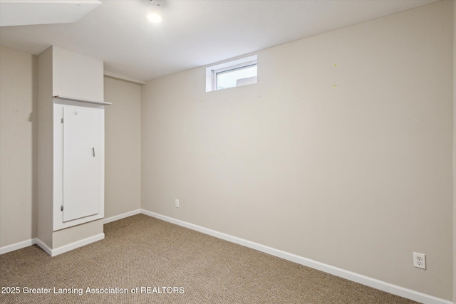 3430 Hawthorne Woods Pkwy, Dewitt, MI 48820 - below grade area with baseboards and light colored carpet