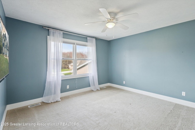 3430 Hawthorne Woods Pkwy, Dewitt, MI 48820 - carpeted empty room with visible vents, baseboards, and a ceiling fan