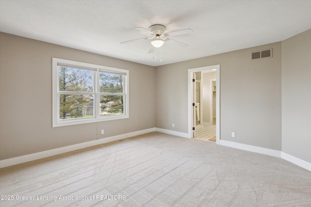 3430 Hawthorne Woods Pkwy, Dewitt, MI 48820 - unfurnished room featuring visible vents, baseboards, a ceiling fan, and light colored carpet