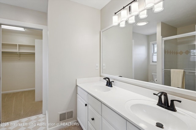 3430 Hawthorne Woods Pkwy, Dewitt, MI 48820 - bathroom with a sink, visible vents, toilet, and a shower stall