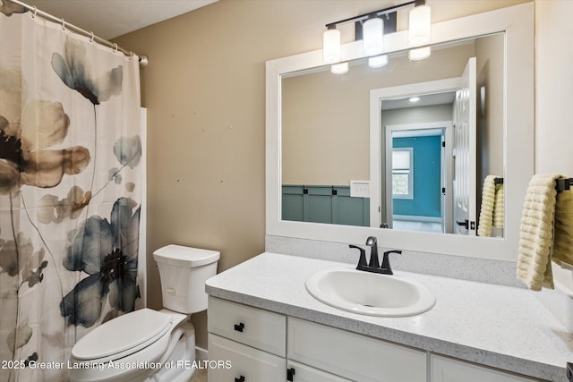3430 Hawthorne Woods Pkwy, Dewitt, MI 48820 - bathroom featuring curtained shower, vanity, and toilet