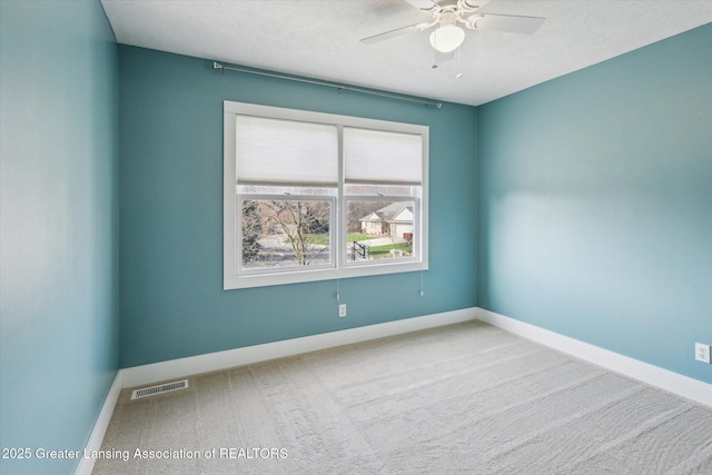 3430 Hawthorne Woods Pkwy, Dewitt, MI 48820 - carpeted spare room with visible vents, baseboards, and ceiling fan