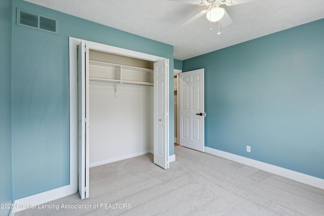 3430 Hawthorne Woods Pkwy, Dewitt, MI 48820 - unfurnished bedroom with visible vents, baseboards, a closet, a ceiling fan, and carpet floors