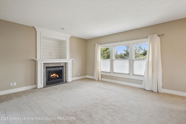 3430 Hawthorne Woods Pkwy, Dewitt, MI 48820 - unfurnished living room with baseboards, a fireplace, and carpet