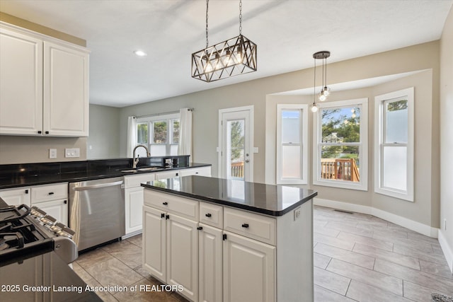 3430 Hawthorne Woods Pkwy, Dewitt, MI 48820 - kitchen featuring visible vents, dark countertops, recessed lighting, pendant lighting, and stainless steel dishwasher