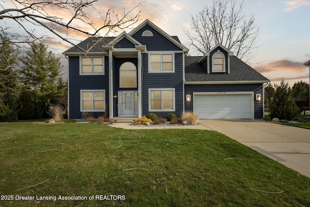 3430 Hawthorne Woods Pkwy, Dewitt, MI 48820 - view of front facade with a garage, a yard, and concrete driveway