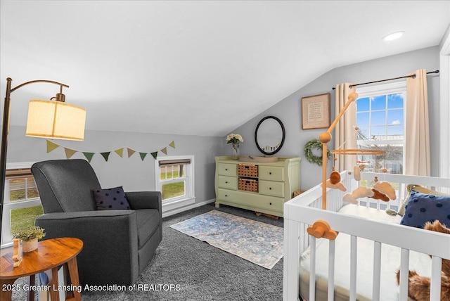bedroom featuring carpet floors and lofted ceiling