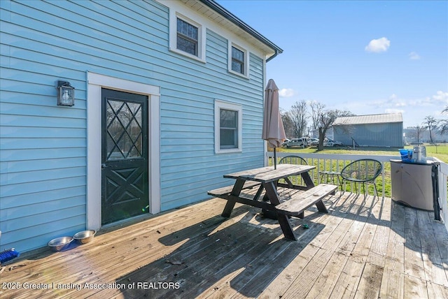 wooden deck featuring outdoor dining space
