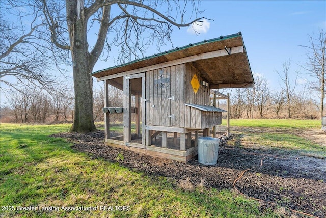 view of poultry coop with a yard