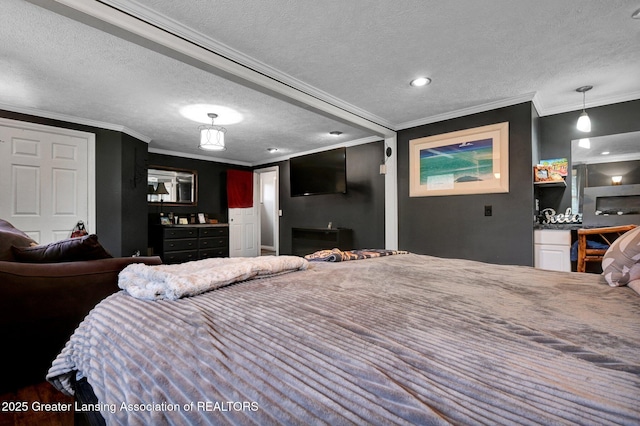 bedroom featuring a textured ceiling and ornamental molding
