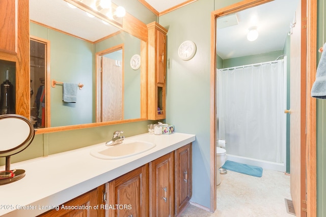 full bathroom featuring toilet, crown molding, vanity, and a shower with shower curtain