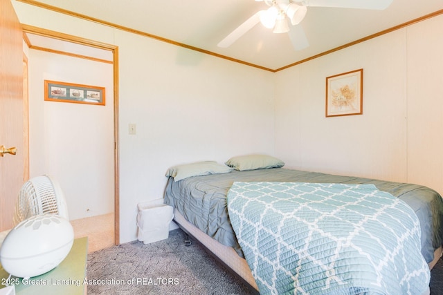 bedroom featuring crown molding, ceiling fan, and carpet floors