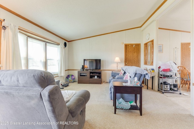 carpeted living room featuring crown molding and lofted ceiling