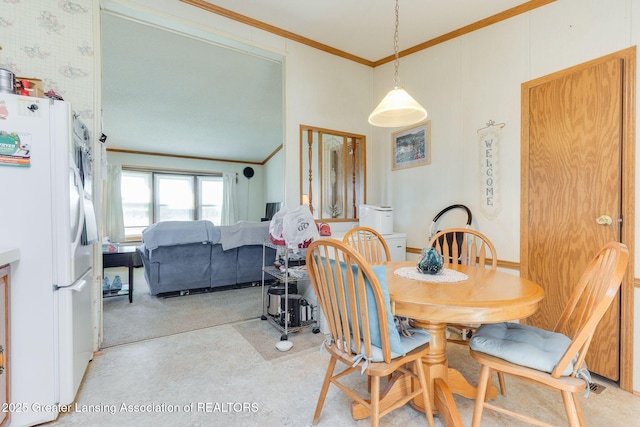 dining area with crown molding