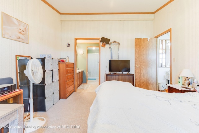 bedroom with crown molding, ensuite bath, light carpet, and wallpapered walls