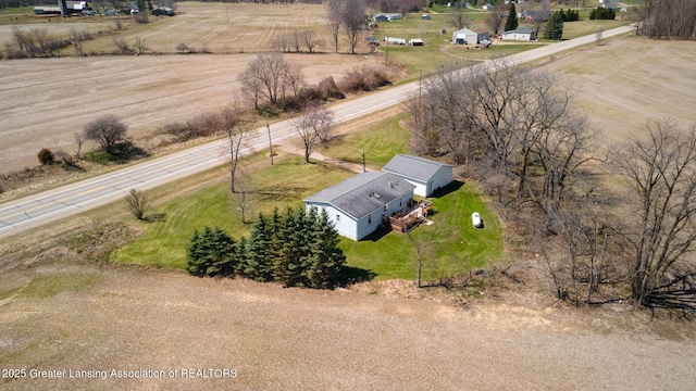 birds eye view of property with a rural view
