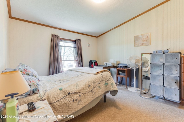 bedroom with carpet, ornamental molding, and lofted ceiling