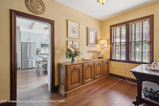 728 Audubon Rd, East Lansing, MI 48823 - office area with dark wood-style floors and baseboards