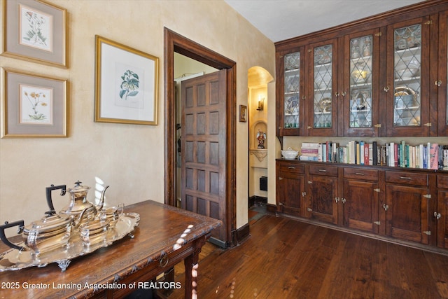 728 Audubon Rd, East Lansing, MI 48823 - office featuring arched walkways and dark wood finished floors