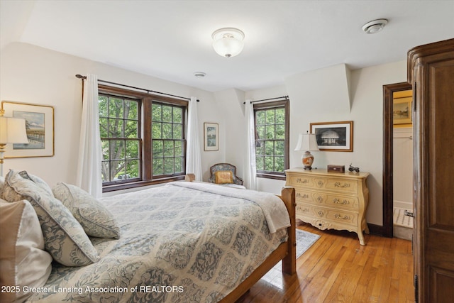 728 Audubon Rd, East Lansing, MI 48823 - bedroom featuring light wood-style flooring and baseboards