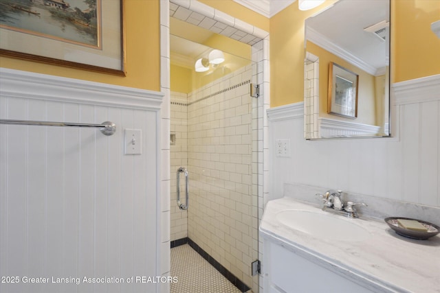 728 Audubon Rd, East Lansing, MI 48823 - full bathroom with a wainscoted wall, crown molding, vanity, and a shower stall