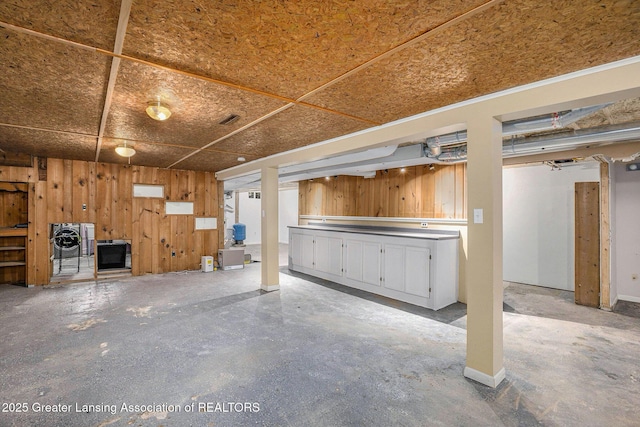 interior space featuring wood walls