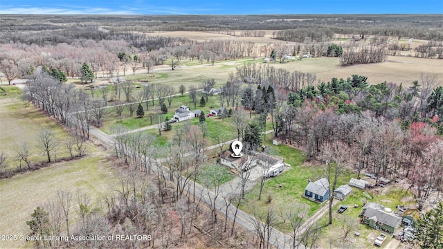 aerial view featuring a rural view and a view of trees