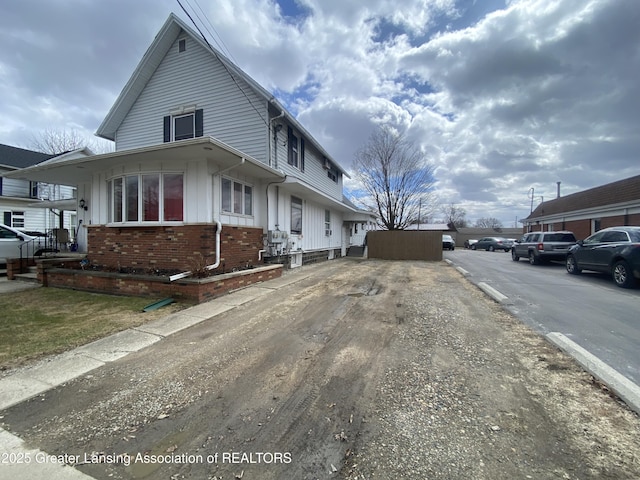 exterior space with brick siding