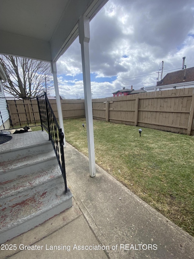 view of yard with a fenced backyard