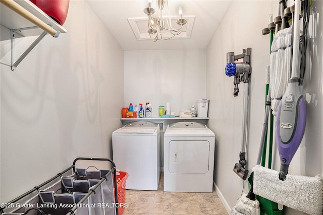 laundry room with baseboards, stone finish flooring, washer and dryer, and laundry area