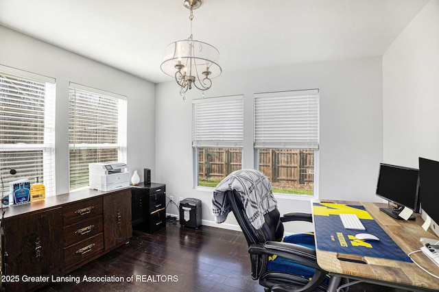 office area featuring baseboards, plenty of natural light, dark wood-style floors, and an inviting chandelier
