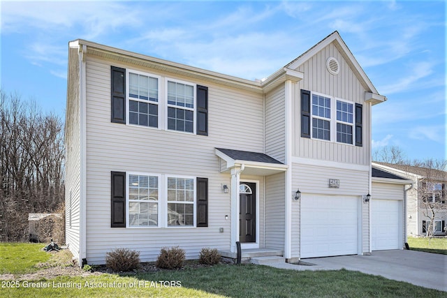 traditional home featuring concrete driveway, a front yard, board and batten siding, and a garage