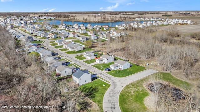 bird's eye view with a residential view and a water view