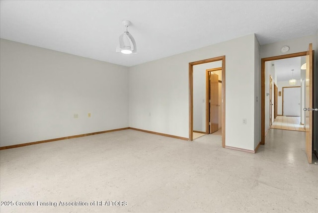 interior space featuring baseboards