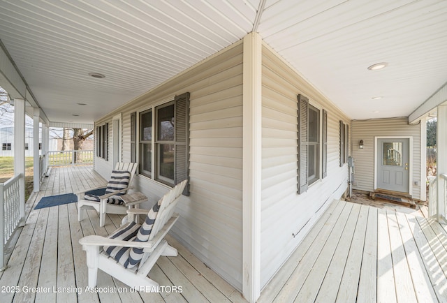 13577 Upton Rd, Bath, MI 48808 - view of wooden porch
