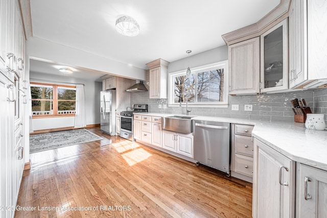 13577 Upton Rd, Bath, MI 48808 - kitchen with stainless steel appliances, a sink, tasteful backsplash, and light wood-style flooring