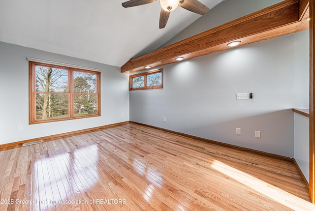 13577 Upton Rd, Bath, MI 48808 - empty room with vaulted ceiling, ceiling fan, baseboards, and light wood-type flooring