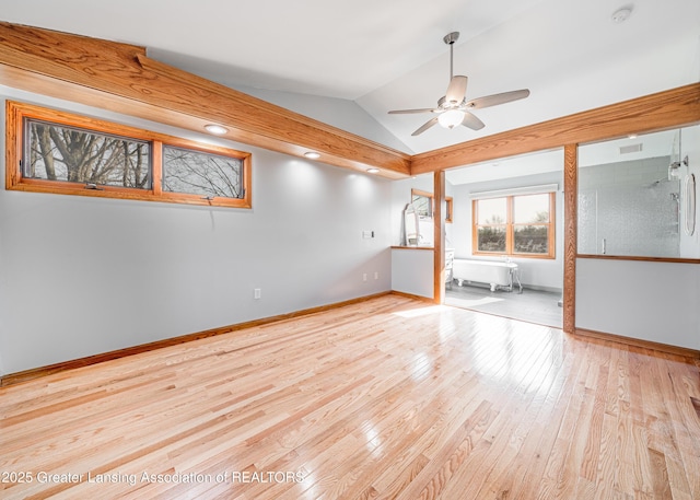 13577 Upton Rd, Bath, MI 48808 - unfurnished room featuring lofted ceiling, hardwood / wood-style flooring, a ceiling fan, baseboards, and a smoke detector