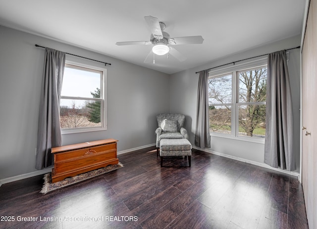 13577 Upton Rd, Bath, MI 48808 - living area featuring wood finished floors, ceiling fan, and baseboards
