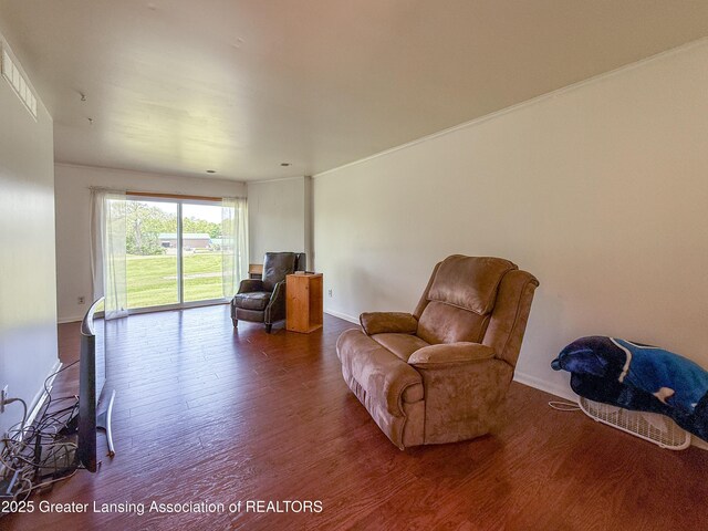 515 N Putnam St Unit B, Williamston, MI 48895 - sitting room featuring dark wood-style floors and baseboards