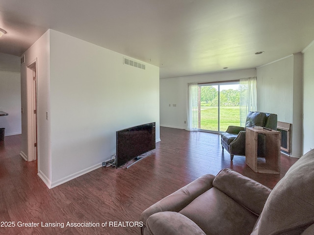 515 N Putnam St Unit B, Williamston, MI 48895 - living room featuring wood finished floors and baseboards