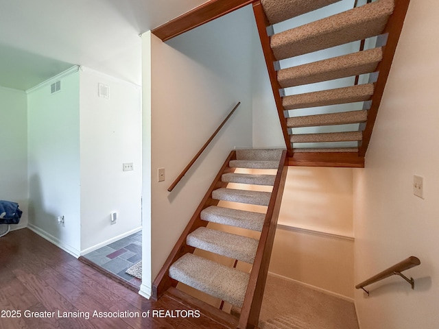 515 N Putnam St Unit B, Williamston, MI 48895 - staircase with wood finished floors and baseboards