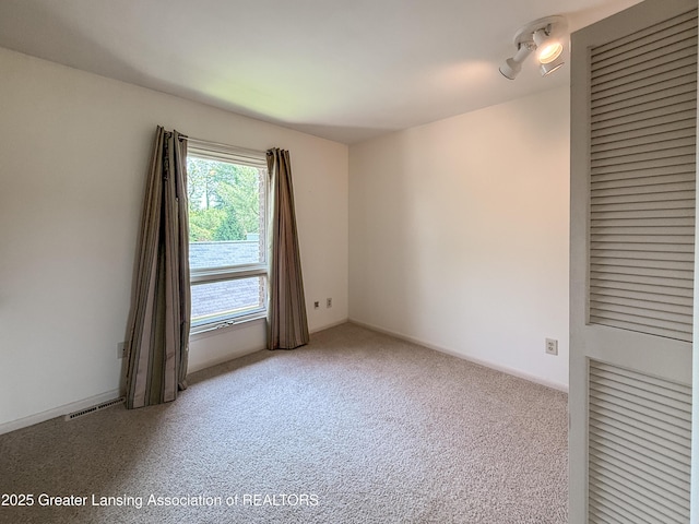 515 N Putnam St Unit B, Williamston, MI 48895 - view of carpeted empty room