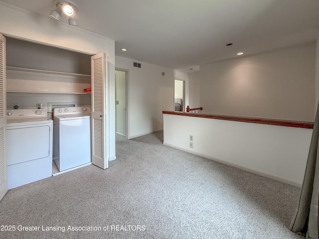 515 N Putnam St Unit B, Williamston, MI 48895 - laundry area with washing machine and clothes dryer, light colored carpet, and recessed lighting