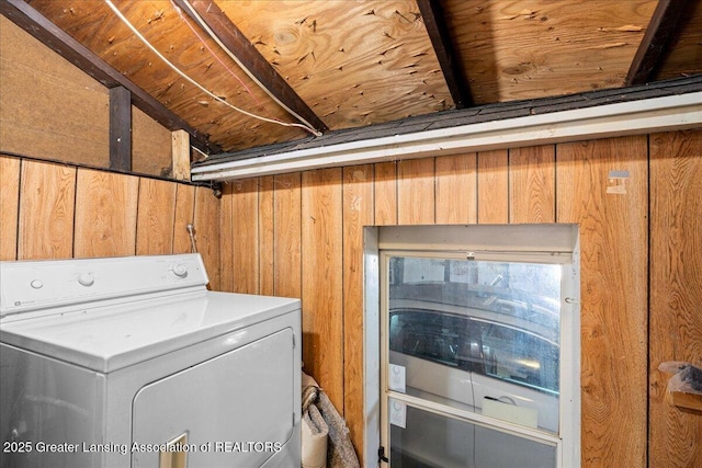 laundry room with washer / dryer, wood walls, and laundry area