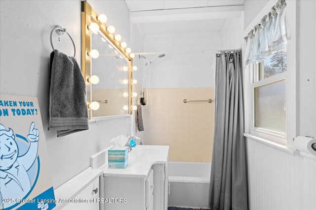 bathroom with shower / tub combo, crown molding, vanity, and a healthy amount of sunlight